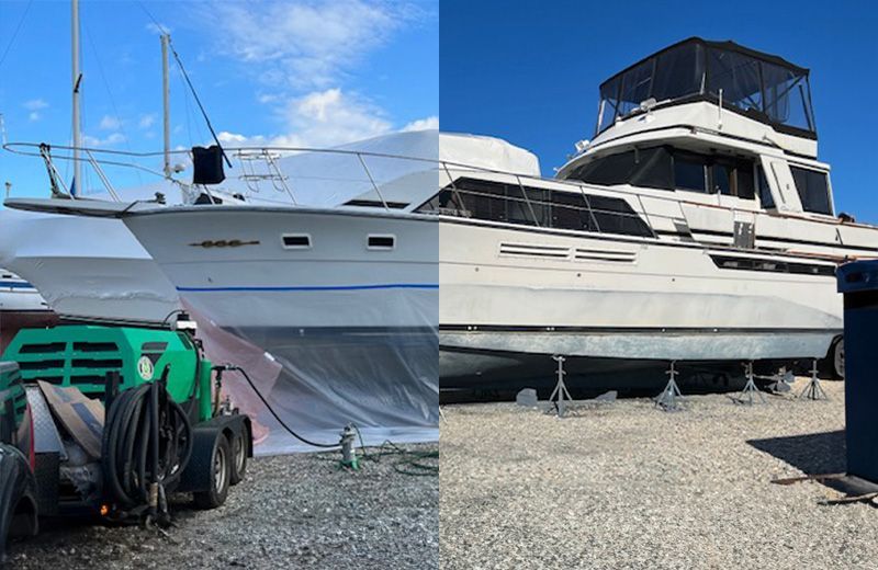 A boat is being painted and a boat is sitting on the ground.
